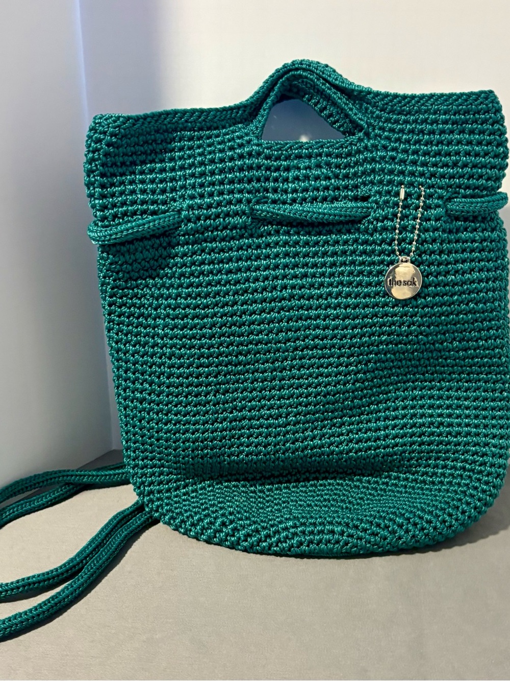 The Sak Emerald Crochet Backpack with Gold Charm